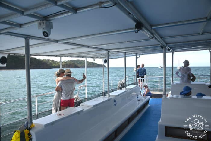 people on covered area of a boat