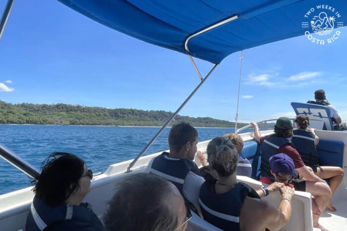 people riding in a speedboat on the ocean