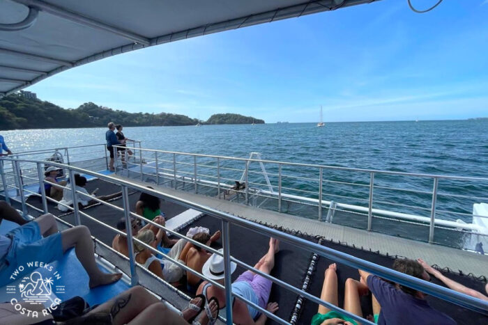 people laying on trampolines on a boat