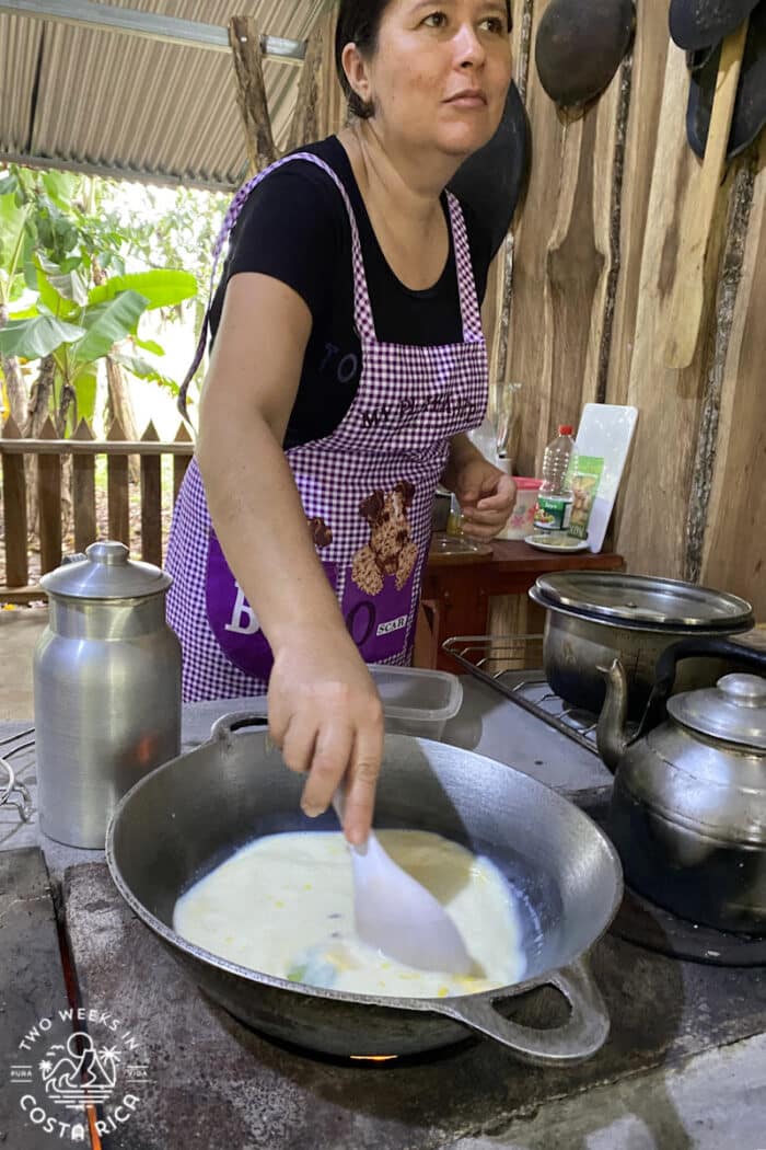 person stirring milk in a pan