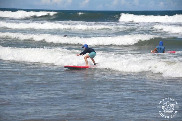 older kid on a surf lesson in nosara